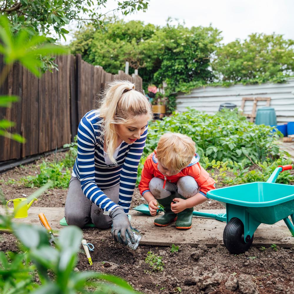 A mother and child garden together