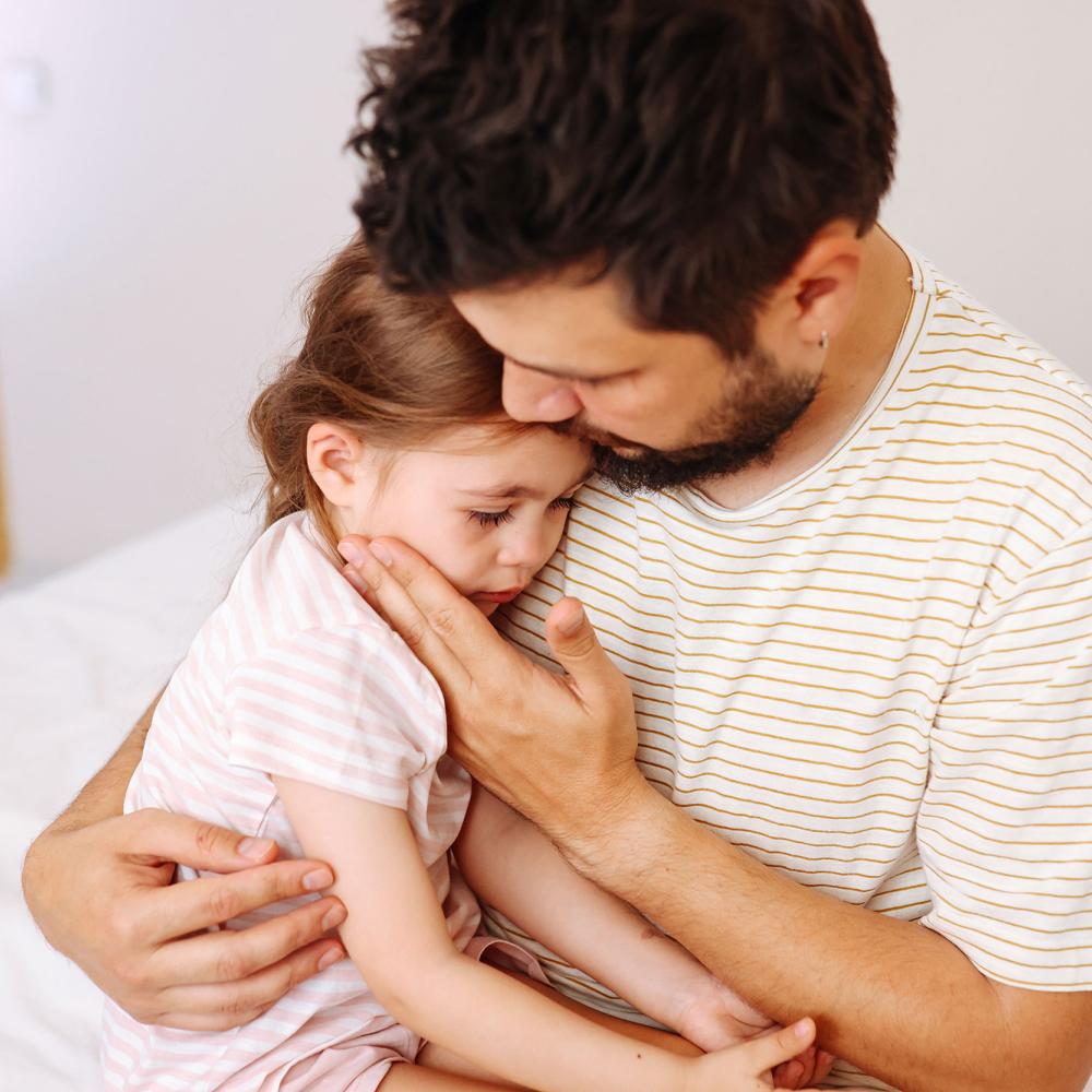 Man holding young girl